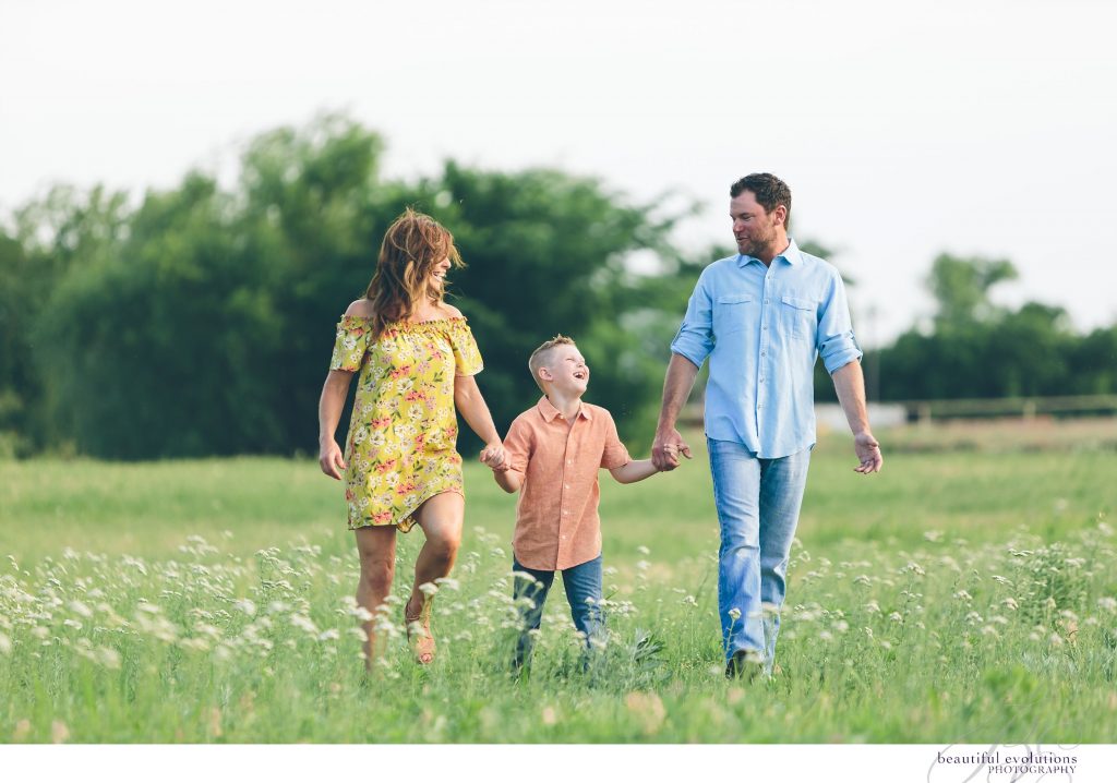 family walking thru the field