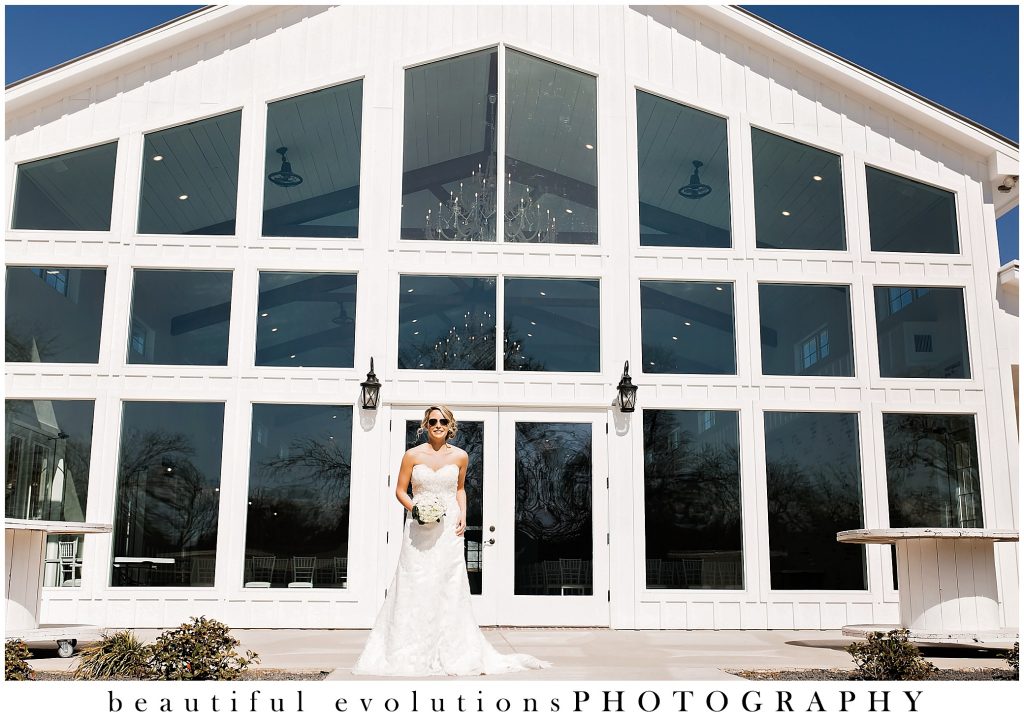 bride outside firefly gardens with sunglasses